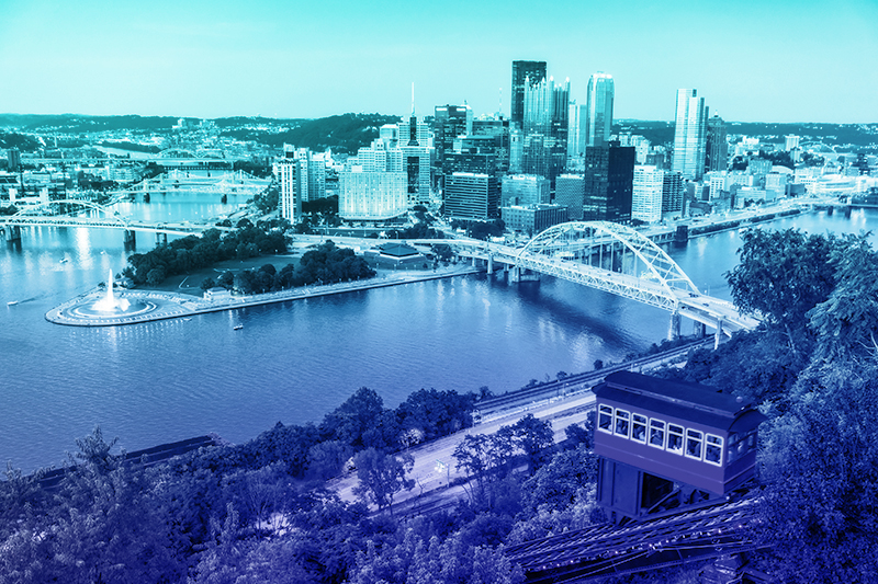 Blue-tinted aerial view of the Cty of Pittsburgh